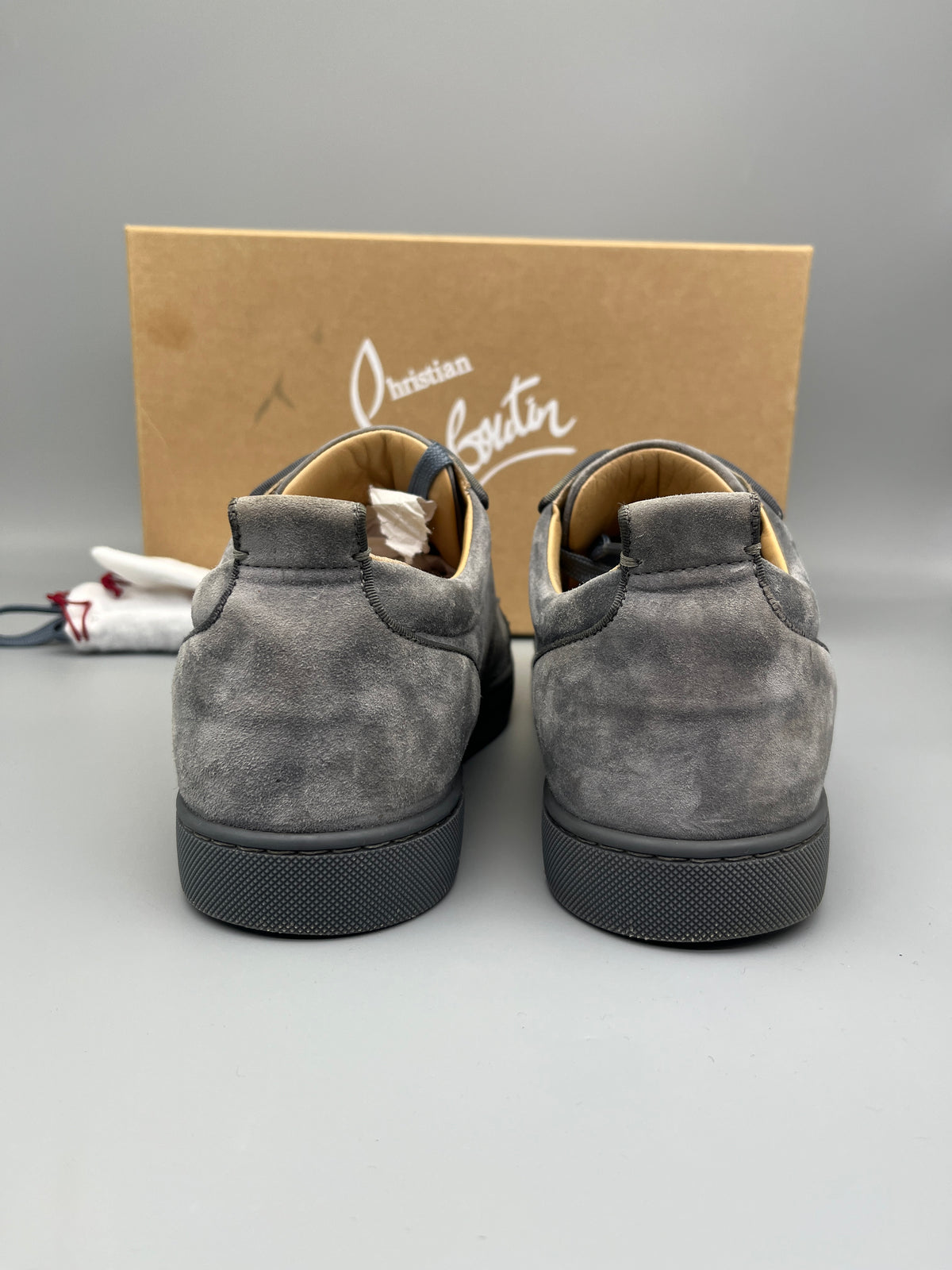 Christian Louboutin Louis Junior Spikes suede sneaker in grey backside angle