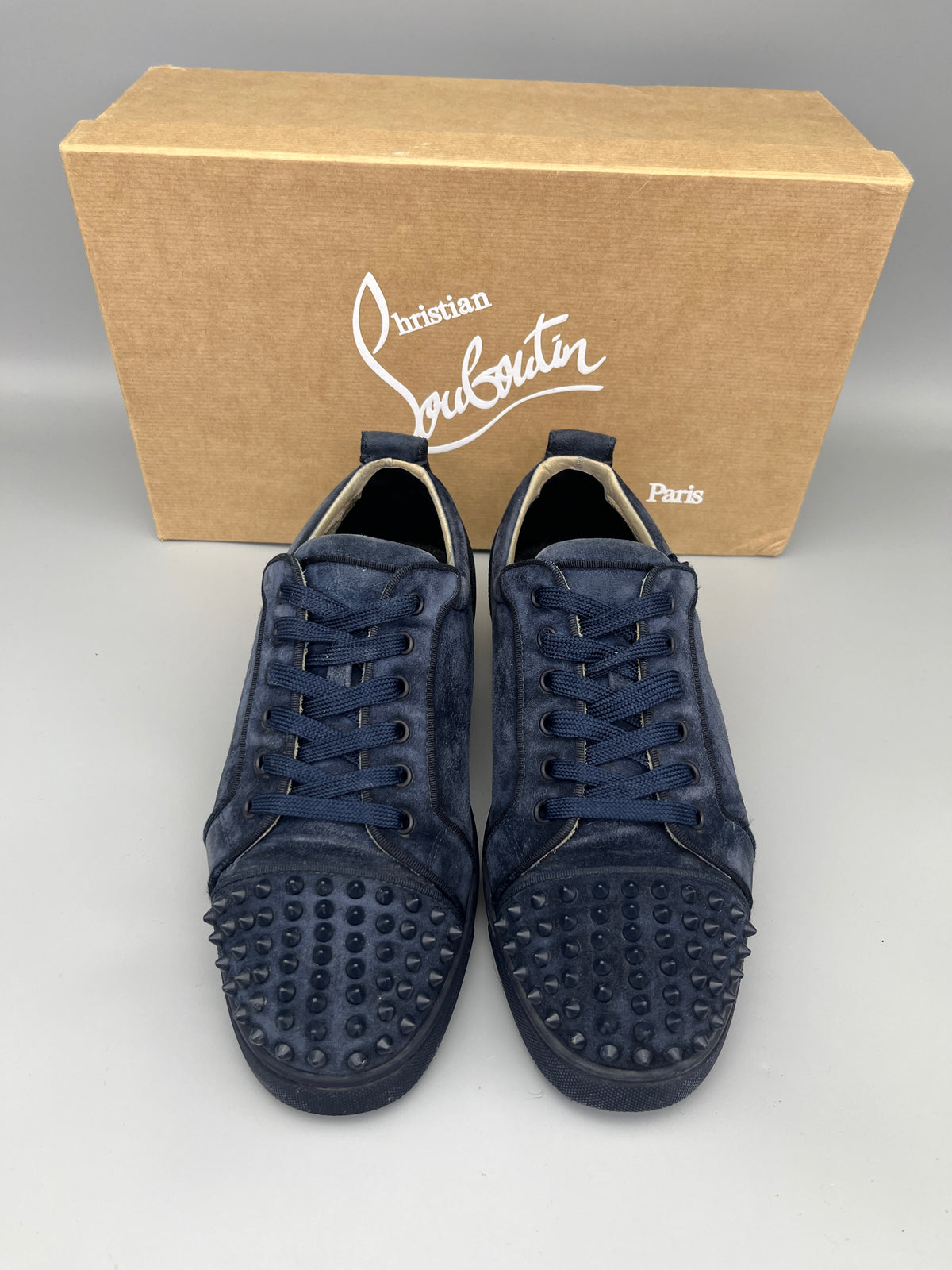 Christian Louboutin Louis Junior Spikes Suede Sneaker in navy – Guaranteed authentic from The Grand Archive.
