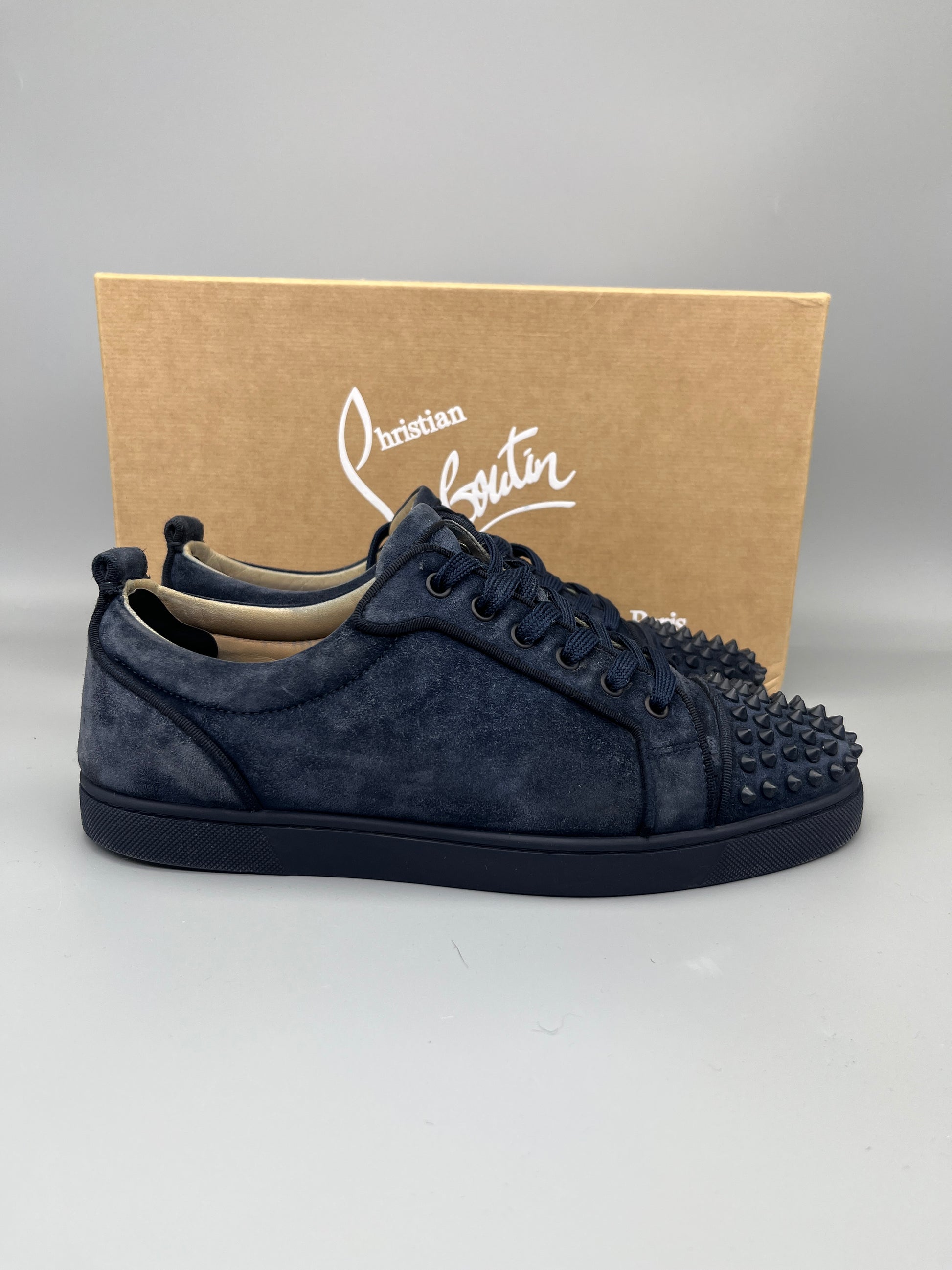 Christian Louboutin Louis Junior Spikes Suede Sneaker in navy – Guaranteed authentic from The Grand Archive.
